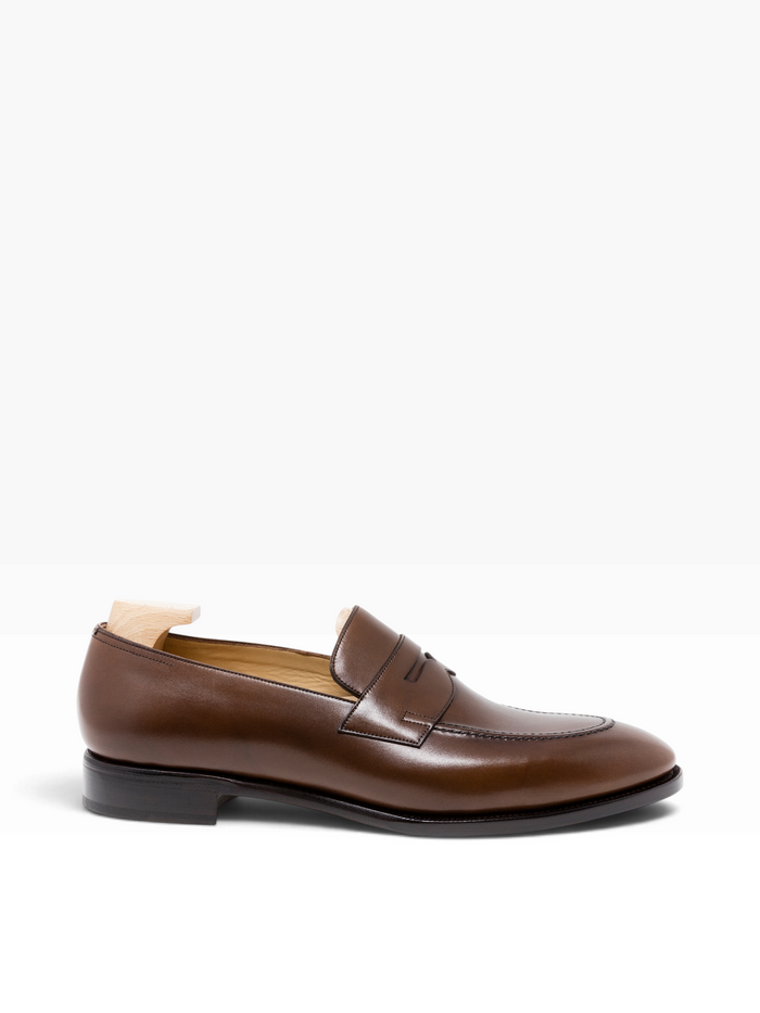 Bourgee a world class shoe store brown Vegano leather penny loafer with a rounded toe and Goodyear welted construction