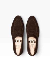 Bourgee a world class shoe store TLB Artista Goya brown suede loafers with wooden shoe trees, top-down view.