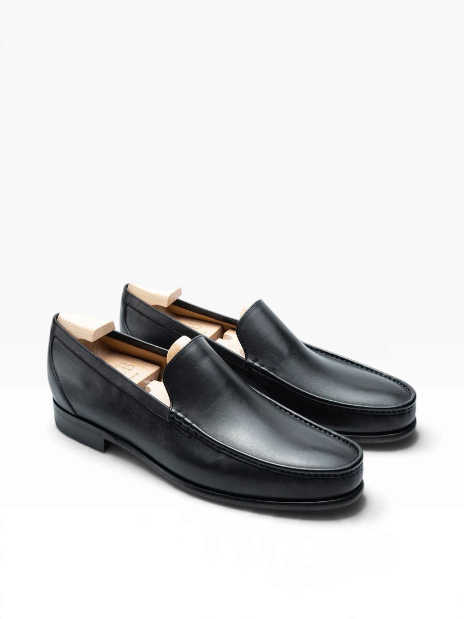 Bourgee a world class shoe store TLB Kiowa black Funchal leather penny loafers with a rounded toe and fusion sole.