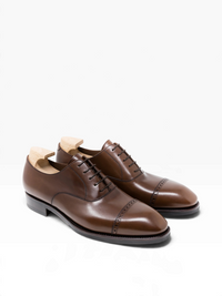 Bourgee a world class shoe store brown Vegano leather Oxford shoes with punched cap toe and Goodyear welted sole.