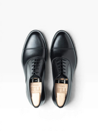 Bourgee a world class shoe store TLB Adam black boxcalf cap toe oxford shoes with wooden shoe trees, top view.