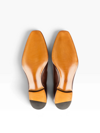 Bourgee a world class shoe store brown leather penny loafer shoes showing the smooth leather sole and bevelled waist
