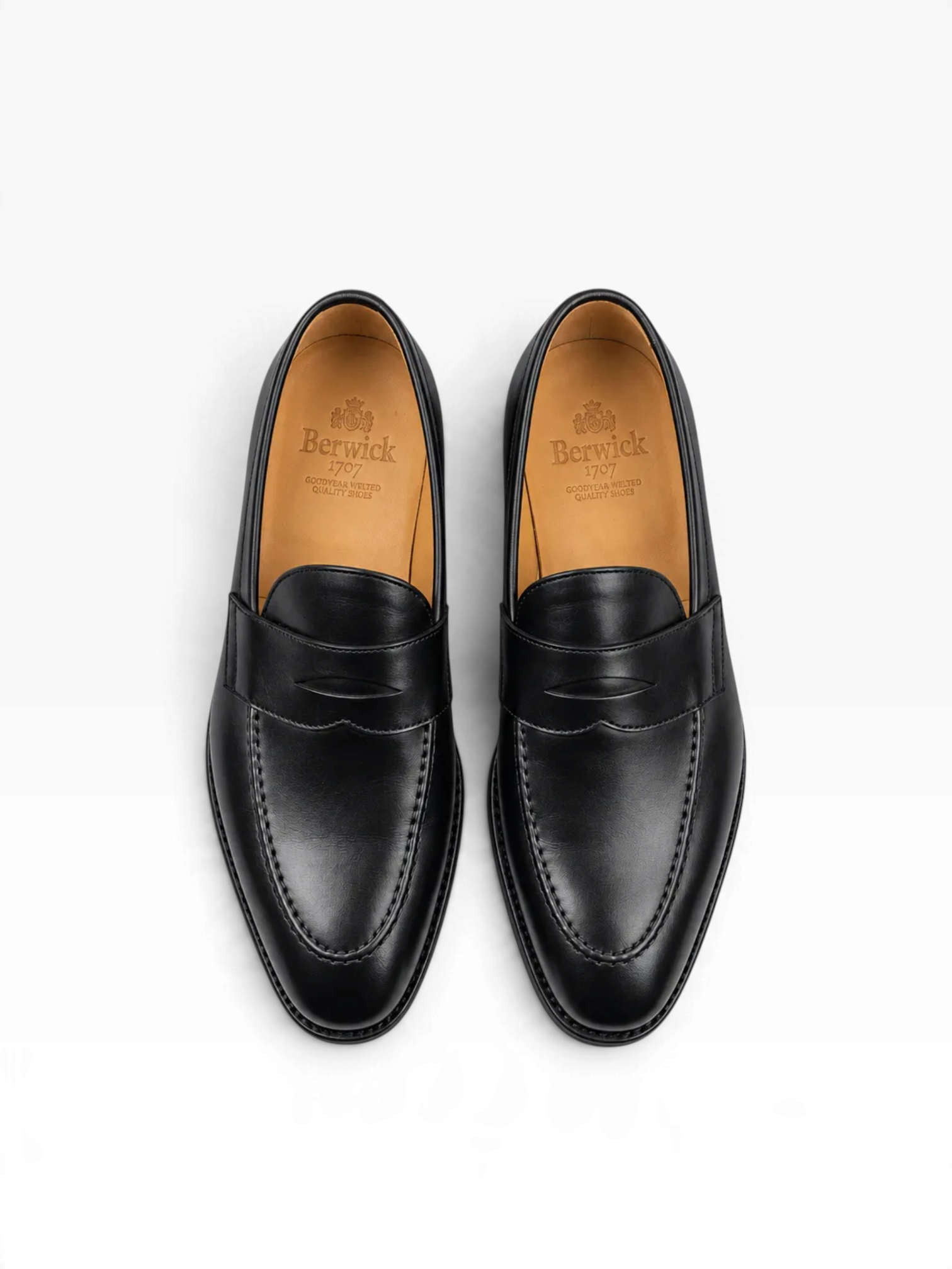 Bourgee a world class shoe store Berwick 5461 black leather penny loafers with apron detailing and Goodyear welt