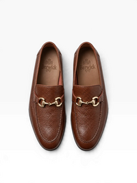 A pair of brown pebbled leather penny loafers with gold-tone horsebit hardware, shown from a top-down view on a white background. The brand name 'Berrick' is visible on the insoles.