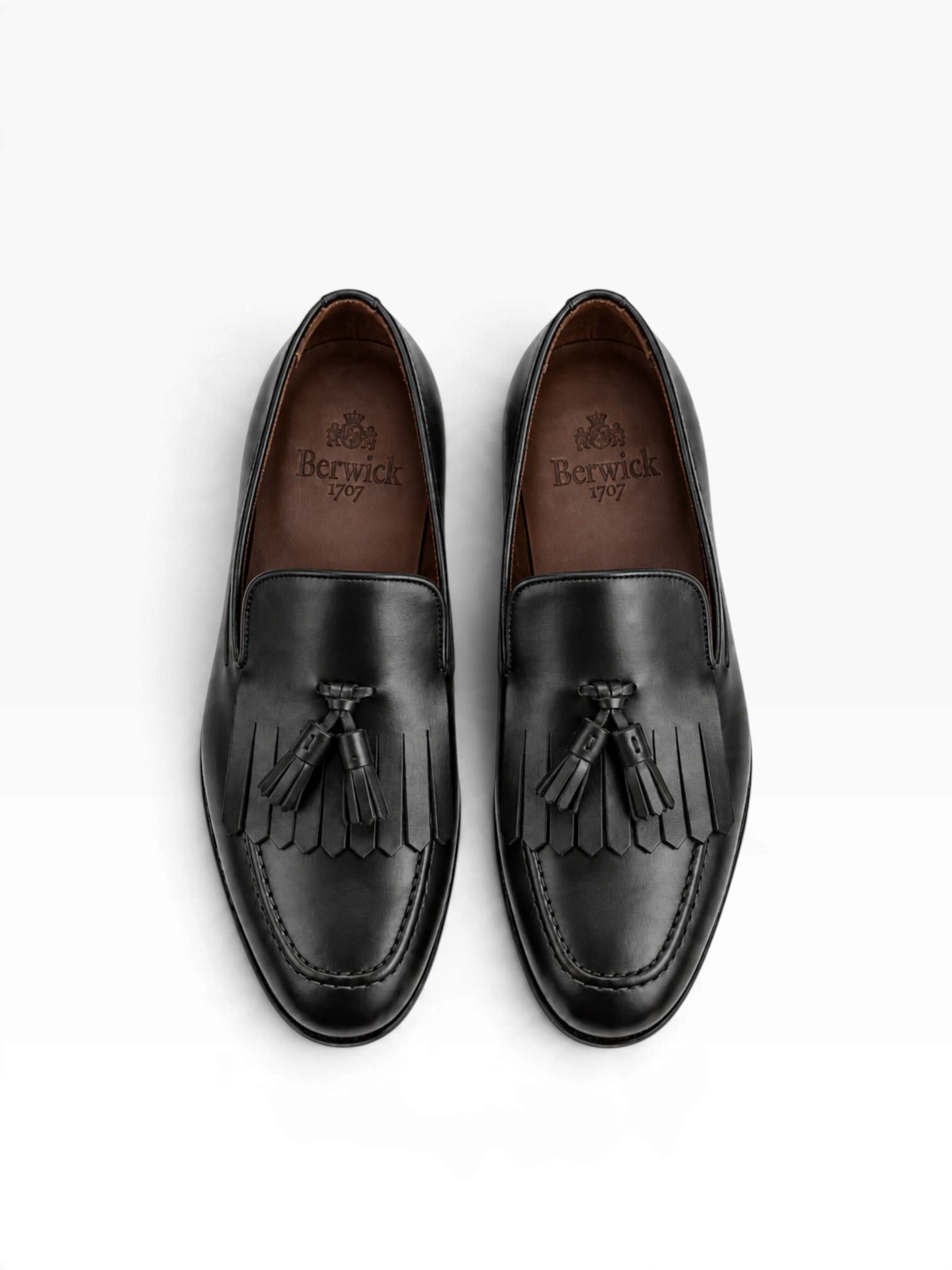 Bourgee a world class shoe store Berwick 1707 black leather tassel loafers with kiltie fringe and apron toe design