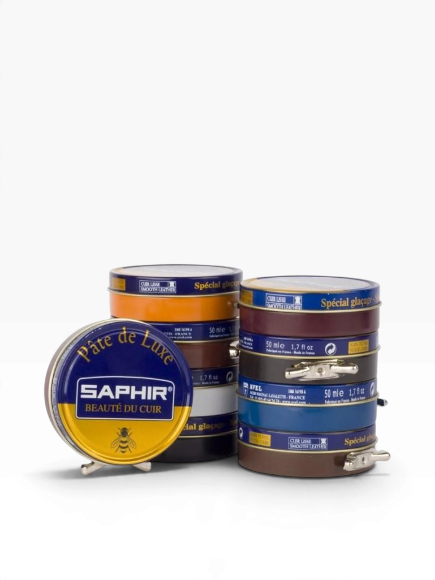 Bourgee a world class shoe store Saphir Beaute du Cuir wax polish tins stacked for leather care and high-gloss shine